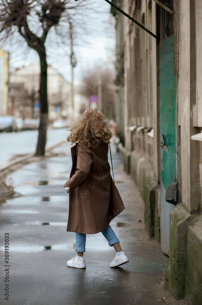 beautiful young woman walking on the street
