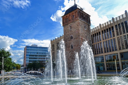 Chemnitz one of the most famous building. Ancient and old building of Red tower (Roter Turm) with people walking around. photo