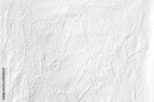 Crumpled paper white background texture 