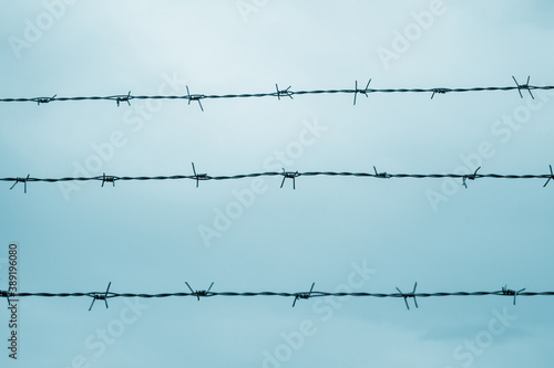Barbed wire fence. Concept of prison  salvation  refugee  lonely.