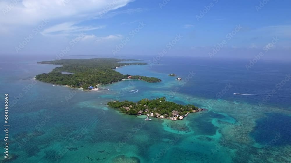 Aerial view of Rosario Islands (Spanish: Islas del Rosario ) off the coast of Cartagena de Indias in the Caribbean Coast Region of Colombia. Aerial view of Rosario Islands (Spanish: Islas del Rosario ) off the coast of Cartagena de Indias in the Caribbean Coast Region of Colombia.
