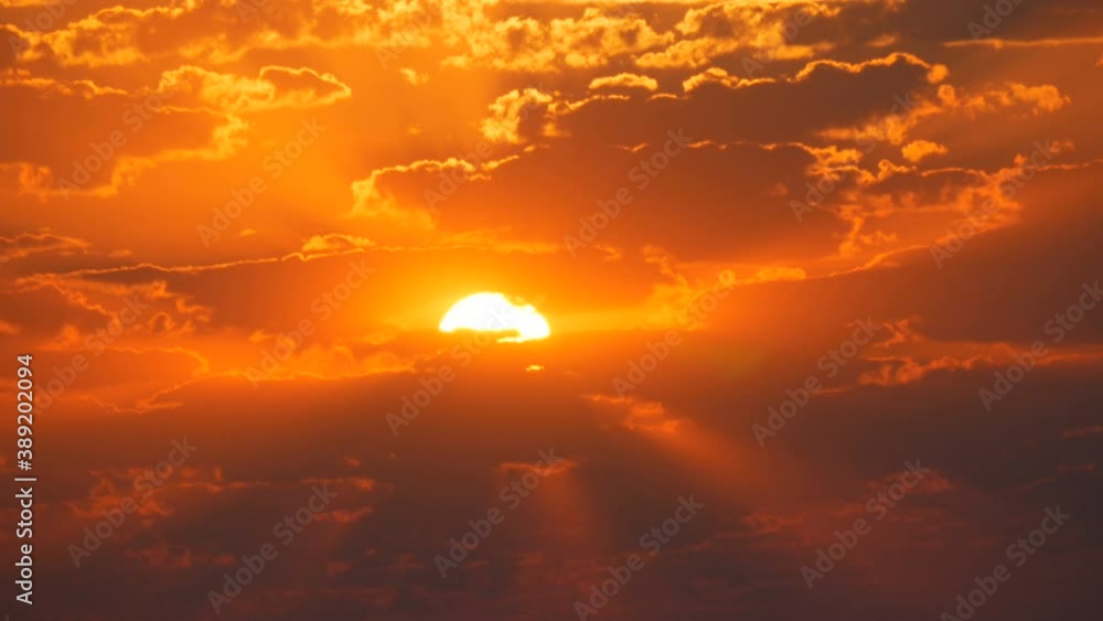 Incredible beautiful amazing red sunrise or sunset surrounded by different clouds in the sky. Incredible beautiful amazing red sunrise or sunset surrounded by different clouds in the sky.