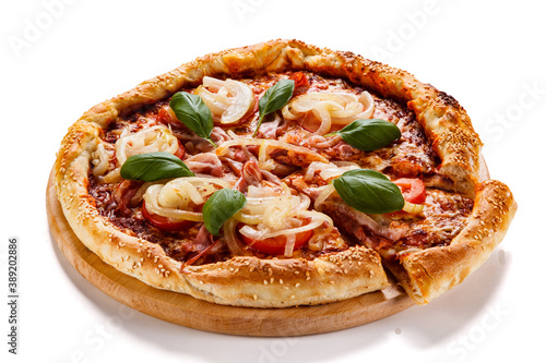 Pizza with ham, mozzarella, champignon, tomatoes and onion on white background 