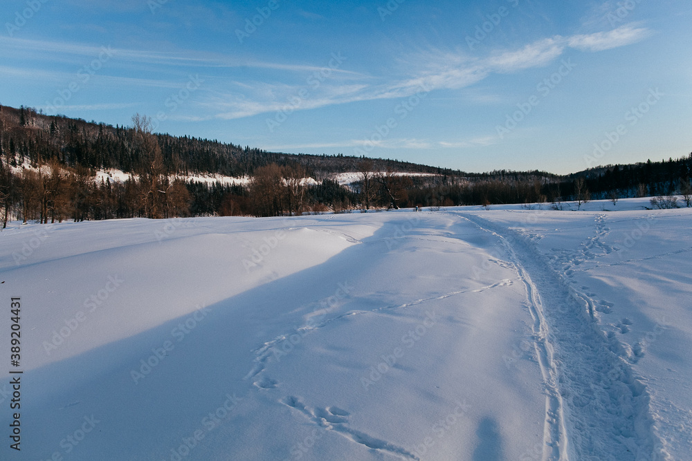 Winter landscape in Russia in the Urals, river Bank covered with snow, Russian winter, cold season Winter landscape in Russia in the Urals, river Bank covered with snow, Russian winter, cold season