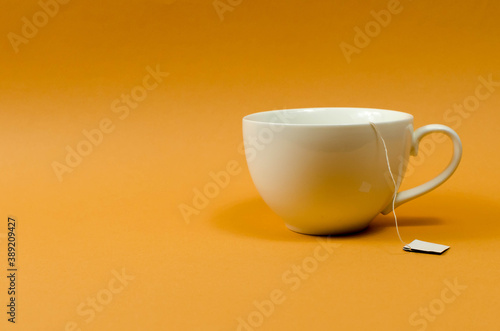 Cup and teapot on the table