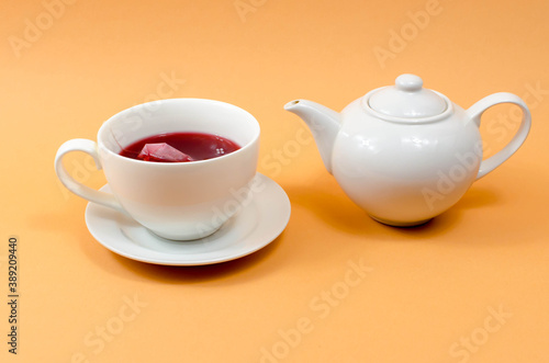 Cup and teapot on the table