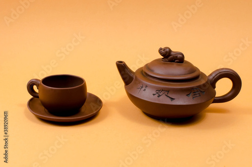 Cup and teapot on the table