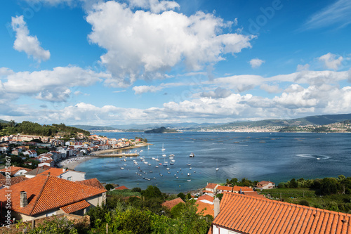 Aerial view of a typical Galician village (Raxo) in the Ria de Pontevedra on a cloudy Summer morning. photo