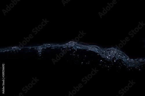 A wave on a black background