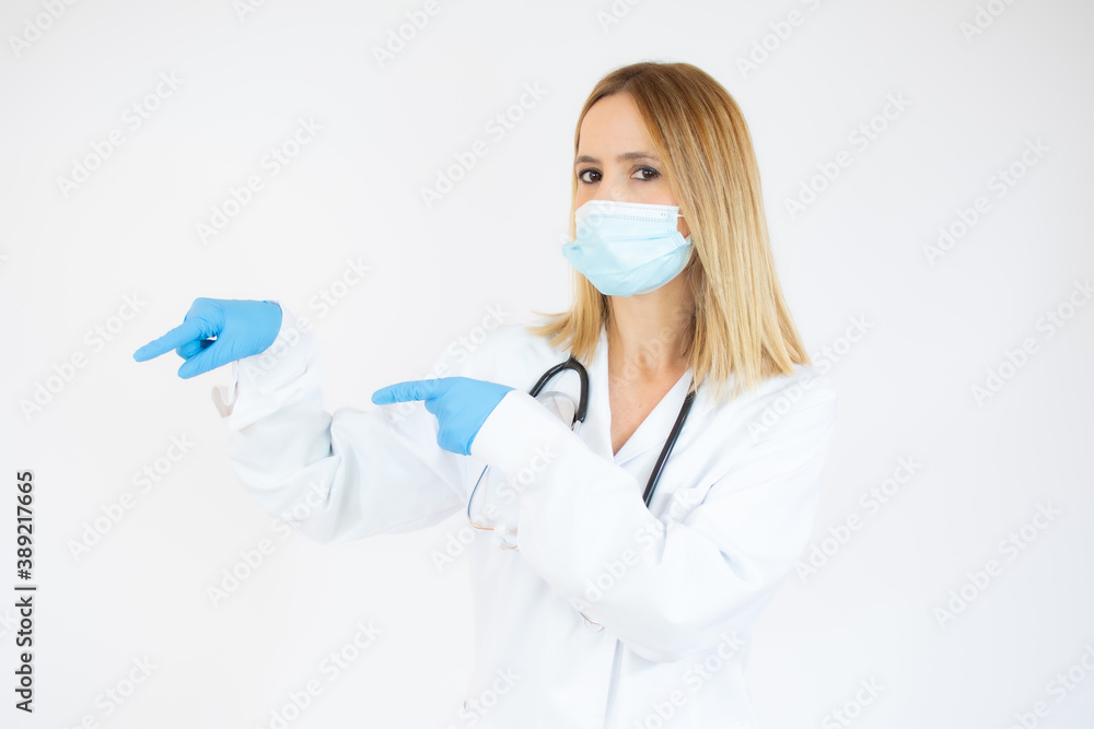 Beautiful female doctor or nurse wearing protective mask and latex or rubber gloves on white background with copy space. Health care concept Beautiful female doctor or nurse wearing protective mask and latex or rubber gloves on white background with copy space. Health care concept