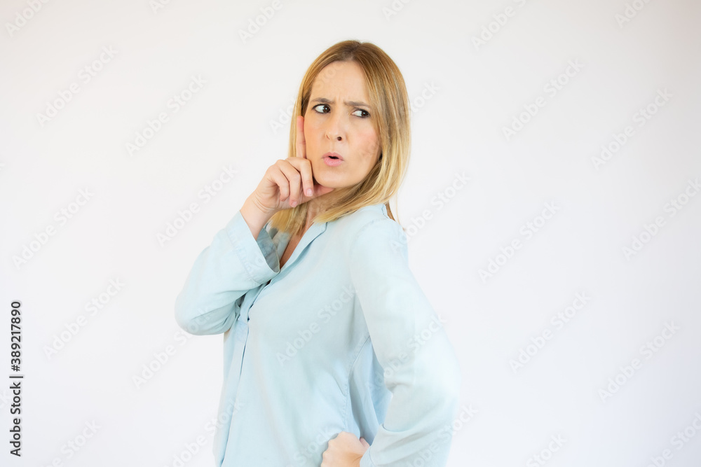 Young woman in casual clothes doubting over white background. Young woman in casual clothes doubting over white background.