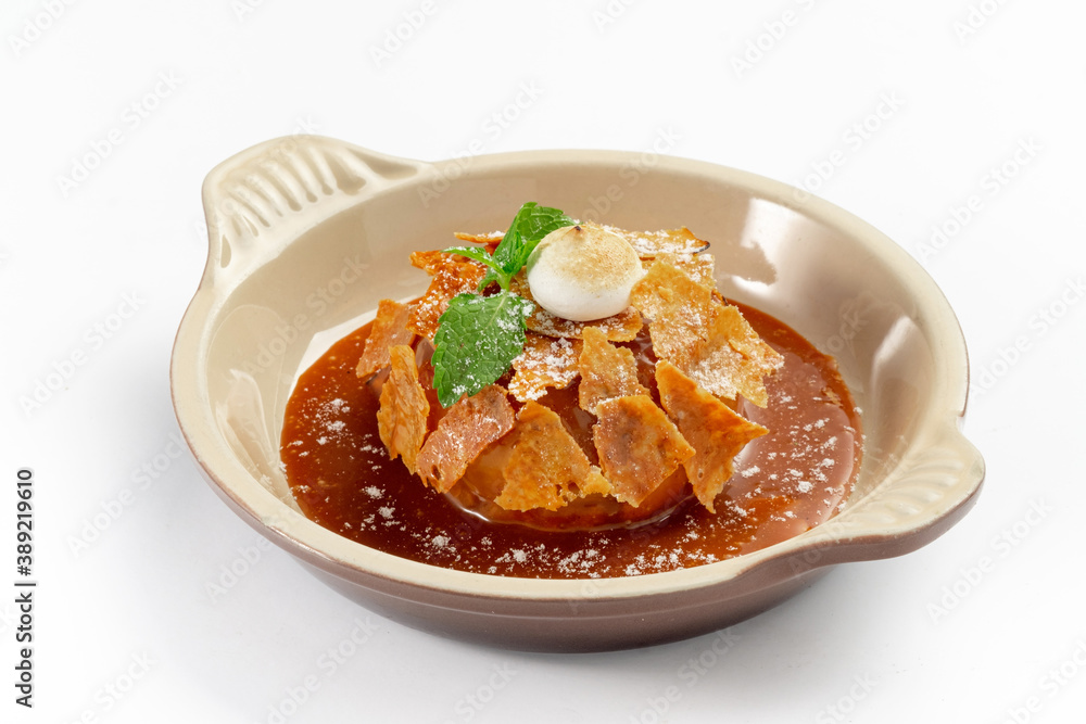 Apple Pie or Tart with caramel, mint crunchy waffles in a bowl on a white background Apple Pie or Tart with caramel, mint crunchy waffles in a bowl on a white background