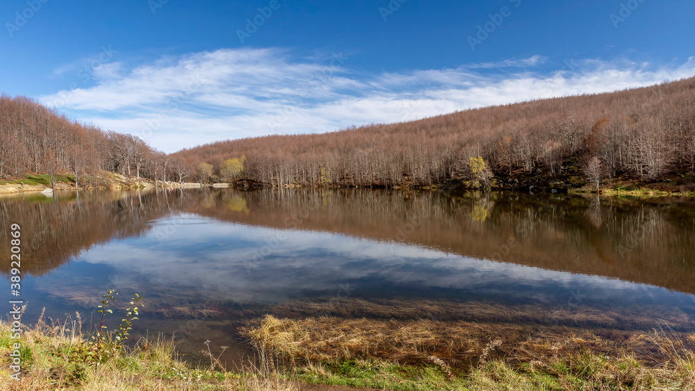 Panoramic view of Lake Baccio near Lake Santo Modenese, Emilia Romagna, Italy, with autumn colors