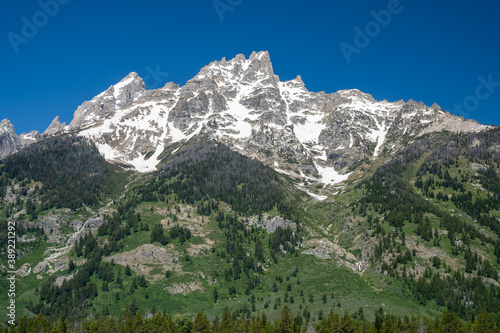Beautiful mountain peaks of Tetons in Grand Teton National Park in Wyoming near Jackson Hole. Clear sunny day with blue sky