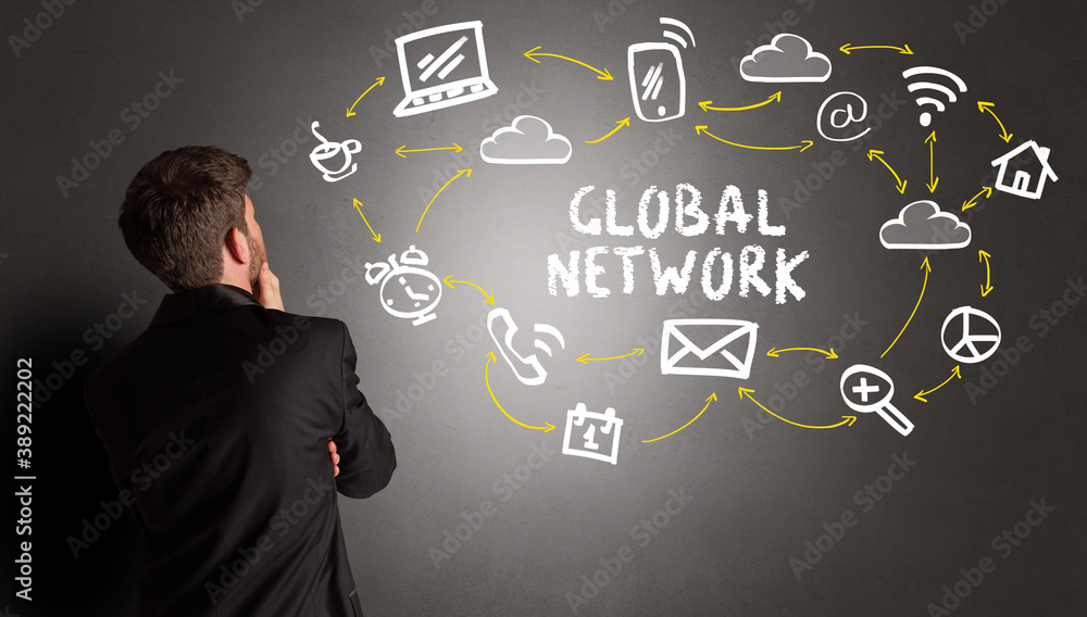 businessman drawing social media icons with GLOBAL NETWORK inscription, new media concept businessman drawing social media icons with GLOBAL NETWORK inscription, new media concept