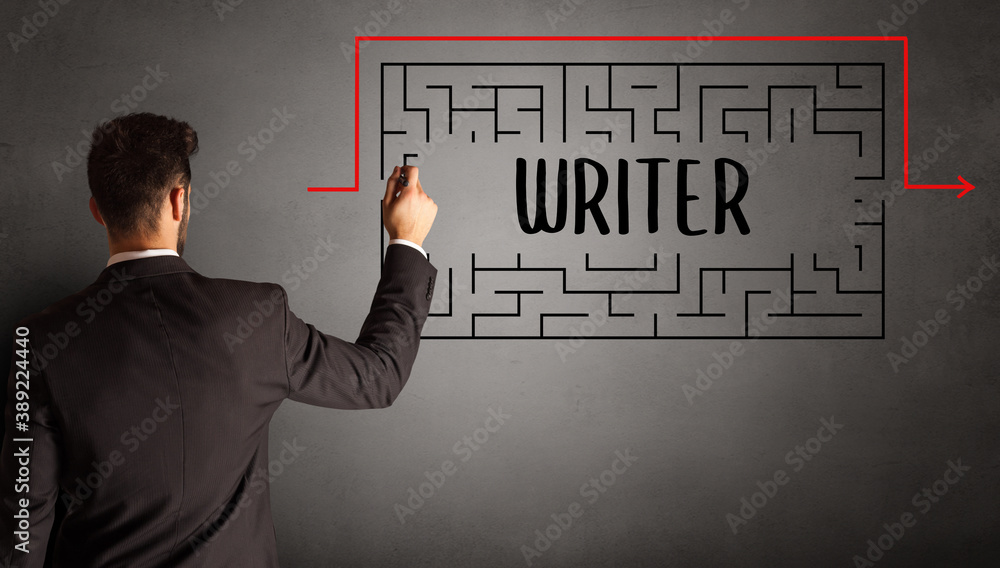 businessman drawing maze with WRITER inscription, business education concept businessman drawing maze with WRITER inscription, business education concept