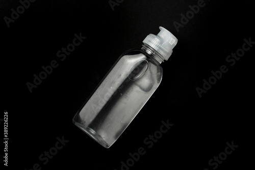 Bottle with antiseptic gel with blue background
