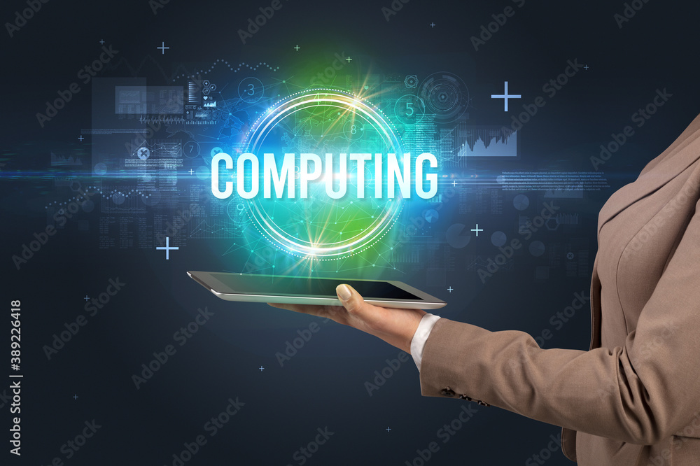 Close-up of a touchscreen with COMPUTING inscription, new technology concept Close-up of a touchscreen with COMPUTING inscription, new technology concept
