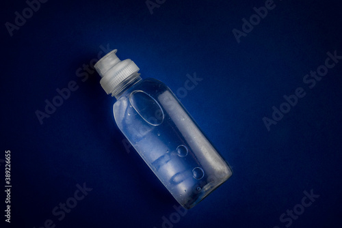 Bottle with antiseptic gel with blue background

