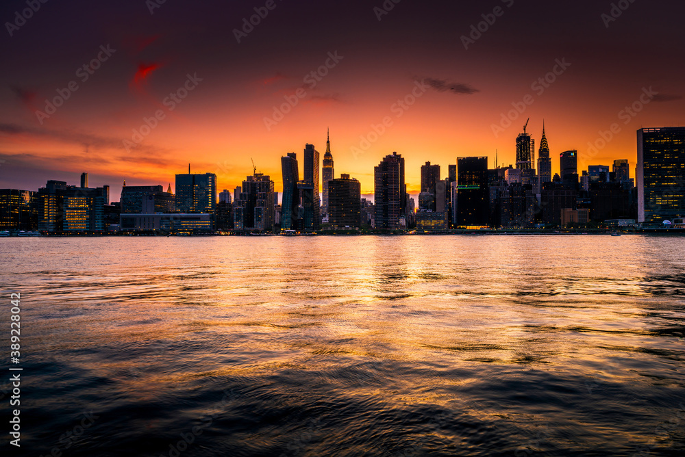 New York City skyline silouhette during a warm orange beautiful sunset