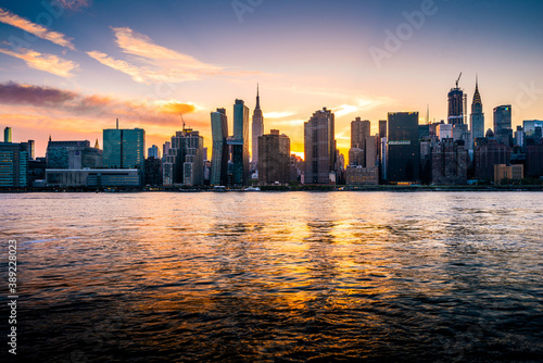 A gorgeous sunset with panoramic view of the New York City skyline of Manhattan