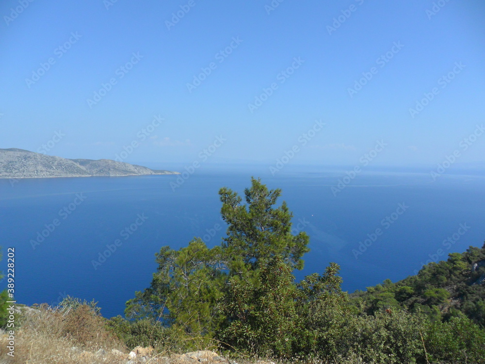 Sunset over the beautiful beaches of the Greek island of Samos in the Aegean Sea, Greece Sunset over the beautiful beaches of the Greek island of Samos in the Aegean Sea, Greece