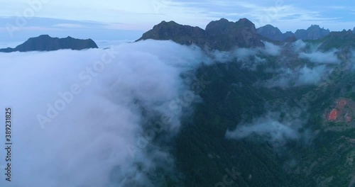 Wallpaper Mural Evening scenery on the island of Madeira. Clouds flow from the mountains into the valley. Aerial view. Torontodigital.ca