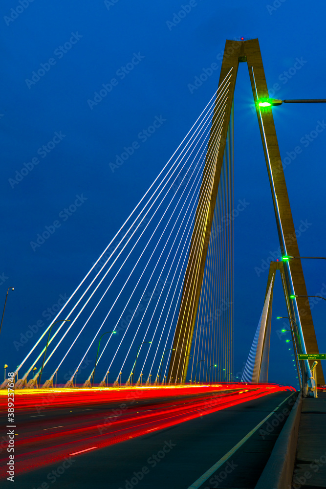 Headlights, Taillights, streaming at dusk across Arthur Ravenel Bridge. Headlights, Taillights, streaming at dusk across Arthur Ravenel Bridge.
