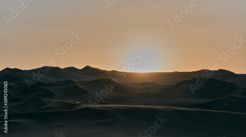 Sunset in the huacachina desert in Peru
