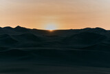 Sunset in the huacachina desert in Peru