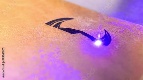 Laser engraving a sign on leather