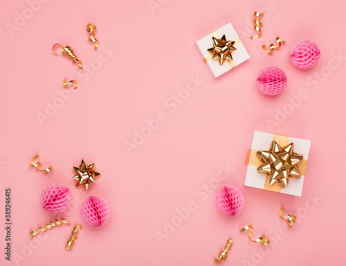 Empty frame, gift box, gold and pink decorations on amaranth pink background. Christmas, new year concept. © Iuliia Metkalova