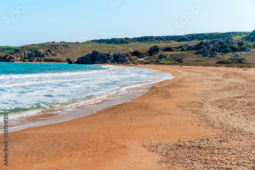 Sea coast with rocks in the water and waves, a delightful panoramic shot on a trip © KseniaJoyg