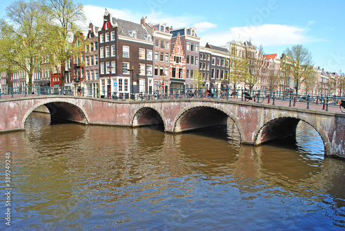 Panorama of the city in the historic center of Amsterdam. Bridges, canals and old buildings.