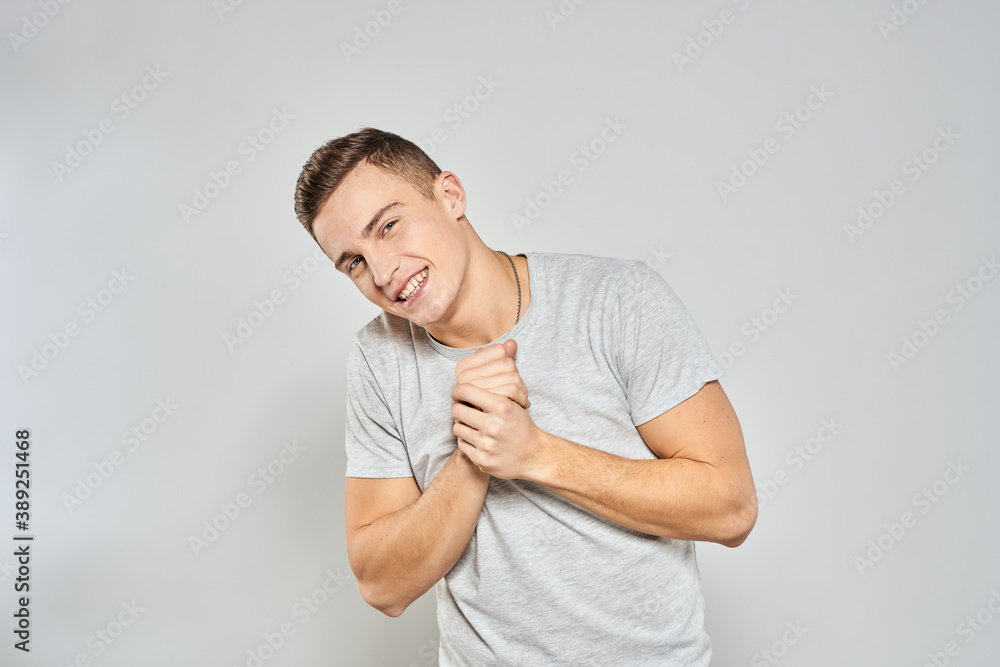 handsome man in light t-shirt cropped view emotion studio isolated background handsome man in light t-shirt cropped view emotion studio isolated background