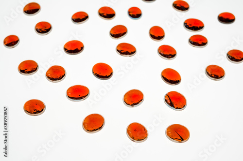 red glass stones on a white background
