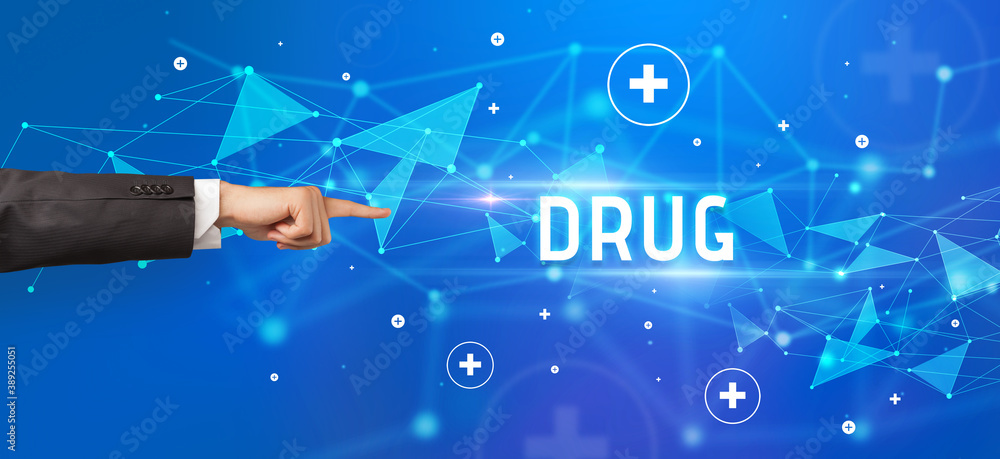 Close-Up of cropped hand pointing at DRUG inscription, medical concept Close-Up of cropped hand pointing at DRUG inscription, medical concept
