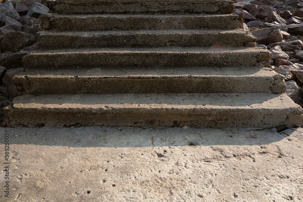 The wreckage of an old cement staircase on the embankment, shot close-up in parallel The wreckage of an old cement staircase on the embankment, shot close-up in parallel