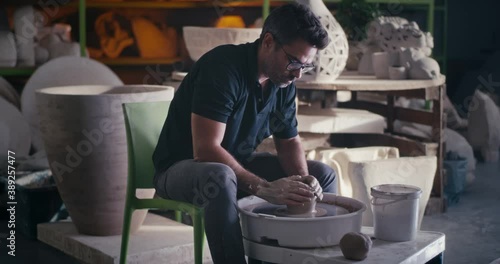 Wallpaper Mural Focused potter making vase on wheel Torontodigital.ca