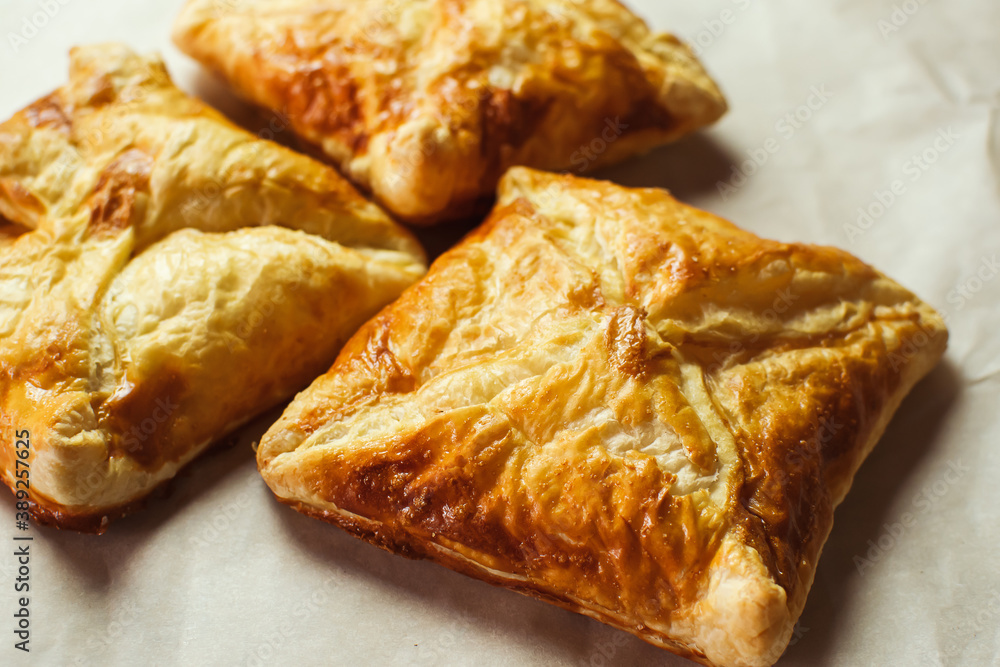 Crunchy puff pastry pies, homemade baking, top view Crunchy puff pastry pies, homemade baking, top view