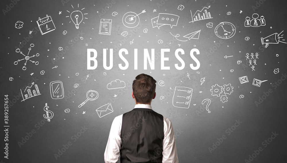 Rear view of a businessman with BUSINESS inscription, modern business concept Rear view of a businessman with BUSINESS inscription, modern business concept
