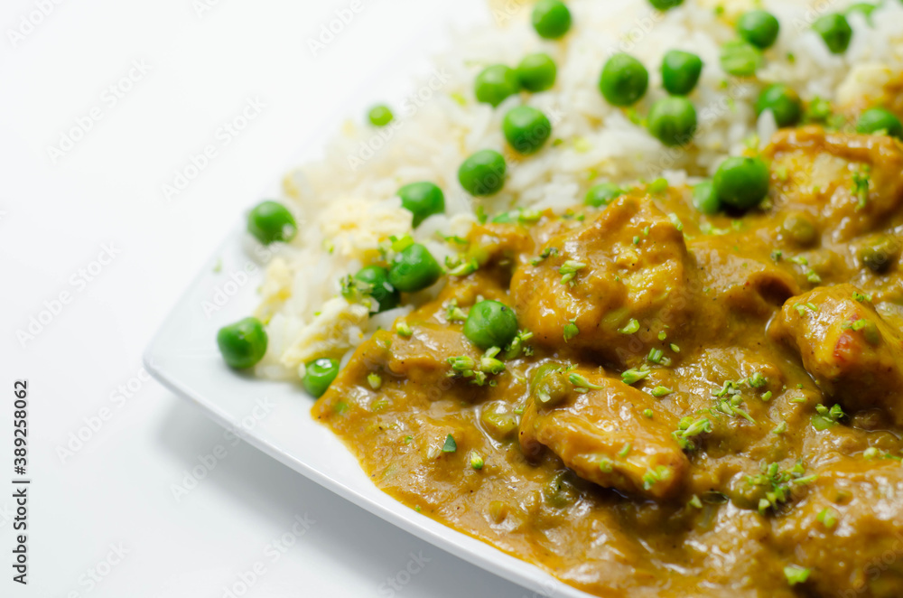 Chicken curry with egg fried rice, chicken breast pieces in a mildly spiced coconut curry sauce with fried rice with peas and egg Chicken curry with egg fried rice, chicken breast pieces in a mildly spiced coconut curry sauce with fried rice with peas and egg