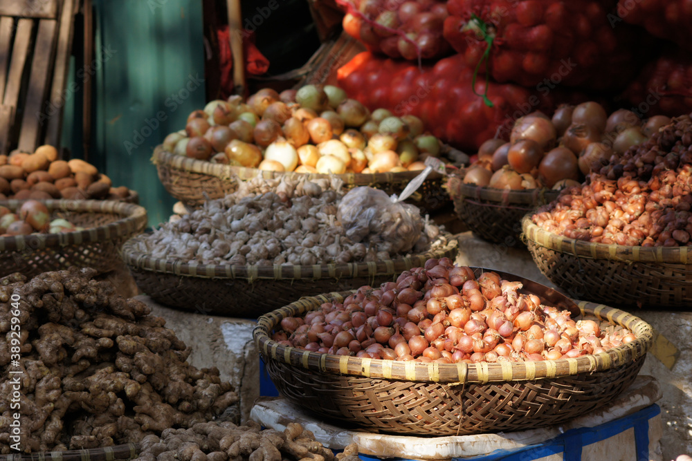 baskets with onions on a market in Vietnam Asia