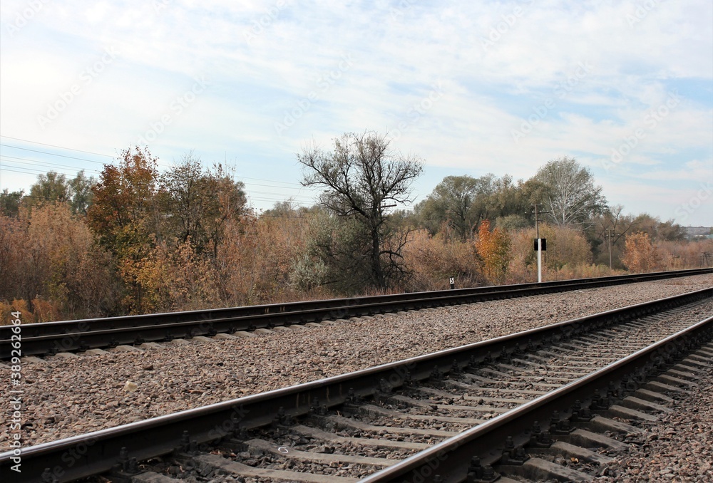 Railway tracks under the autumn sky Railway tracks under the autumn sky