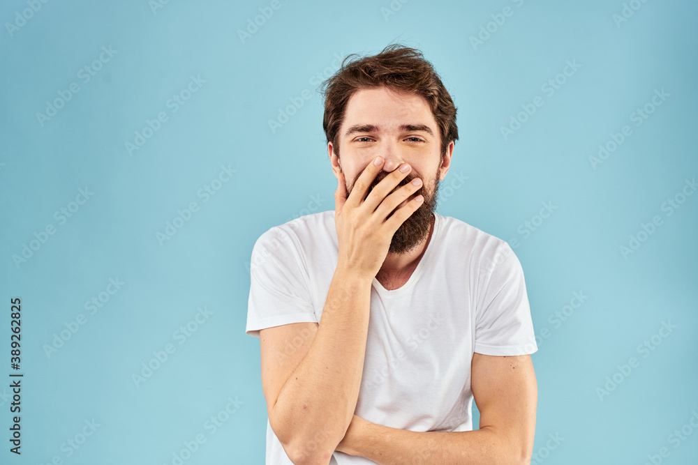 Cheerful man gesturing with his hands emotions cropped view on blue background studio Cheerful man gesturing with his hands emotions cropped view on blue background studio
