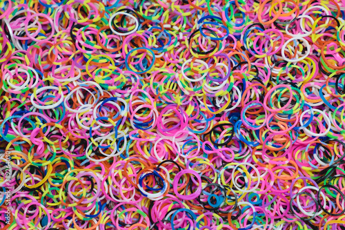 Colorful elastic rubber hair bands. Colorful background.