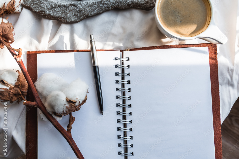 Coffee mug with croissant and empty notebook and pencil for business plan and design ideas onon white cloth from above, cozy and tasty breakfast, vintage toned Coffee mug with croissant and empty notebook and pencil for business plan and design ideas onon white cloth from above, cozy and tasty breakfast, vintage toned