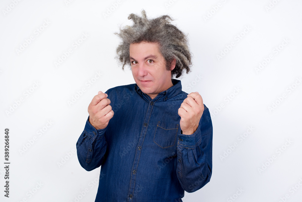 Handsome mature caucasian man with afro grey hair standing over isolated white background doing money gesture with hands, asking for salary payment, millionaire business Handsome mature caucasian man with afro grey hair standing over isolated white background doing money gesture with hands, asking for salary payment, millionaire business