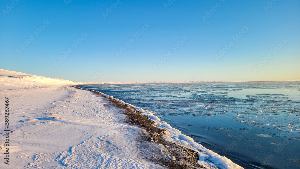 Arctic ocean starting to freeze at the shore line,  near Sachs Harbour on Banks Island Canada