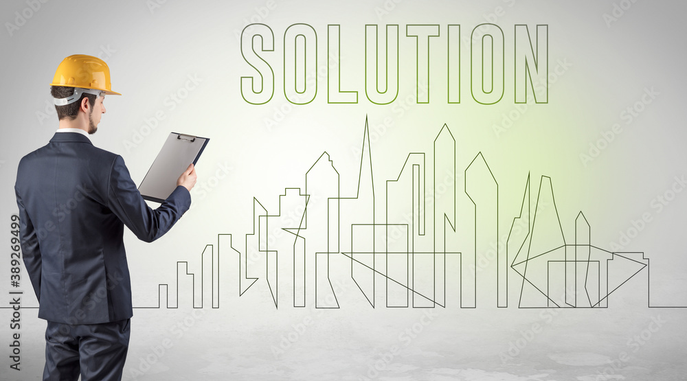 Businessman in hard hat holding blueprint with SOLUTION inscription, engineering and architecture concept Businessman in hard hat holding blueprint with SOLUTION inscription, engineering and architecture concept